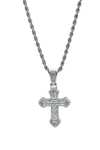 Silver cross pendant necklace on a light gray background