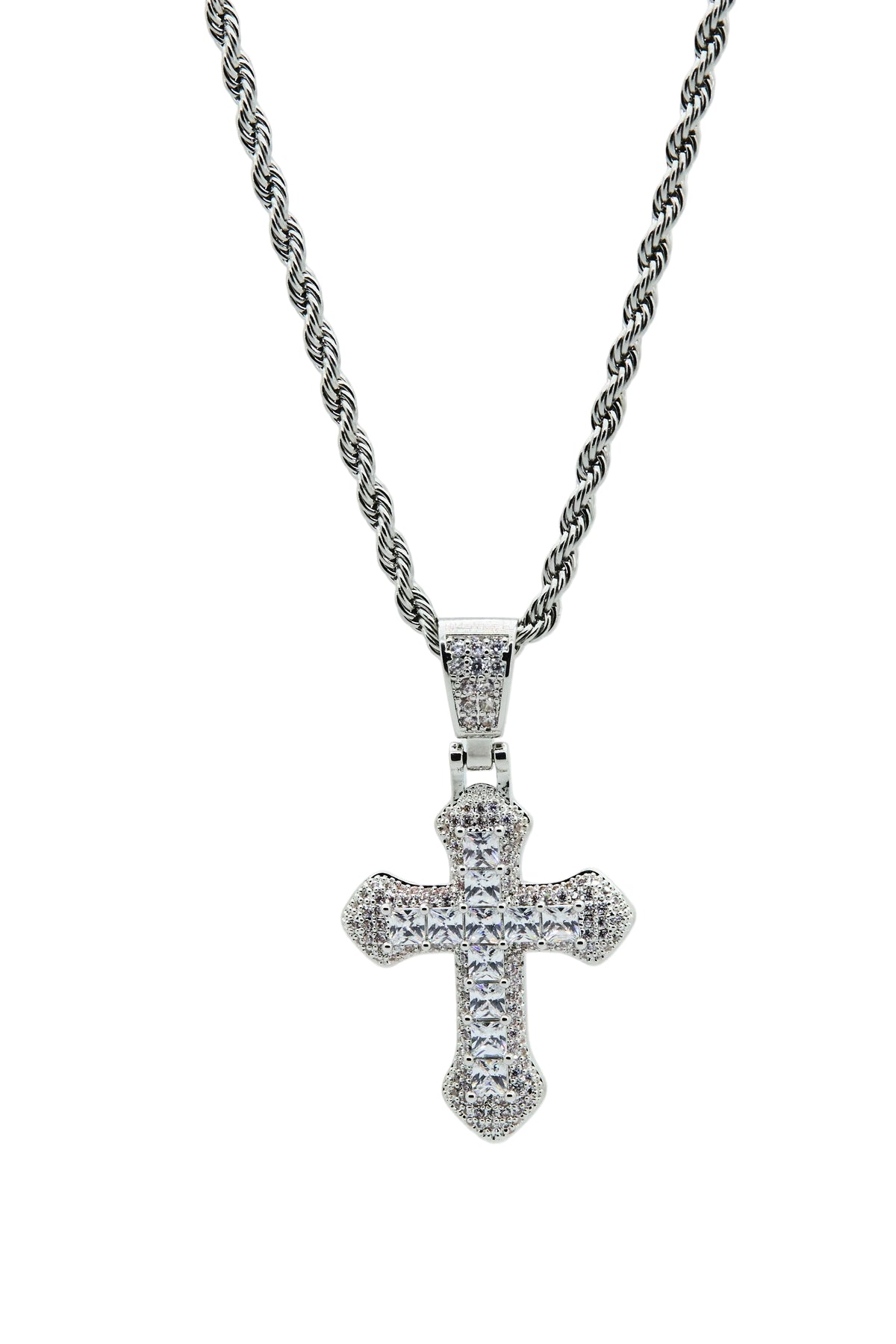 Silver cross pendant necklace on a light gray background